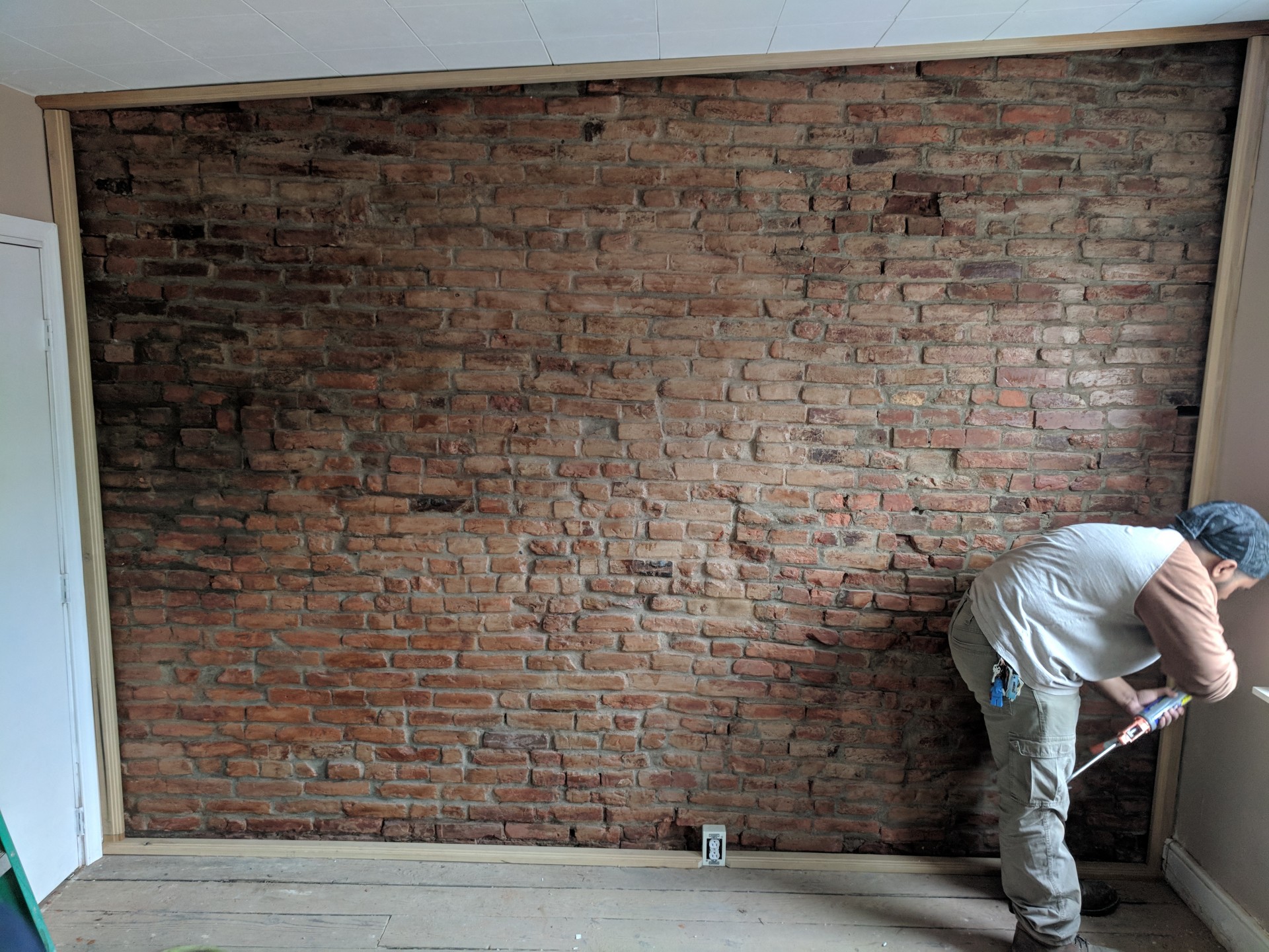 #1 Treated Framed Finished Exposed Brick Wall (Front Bedroom)